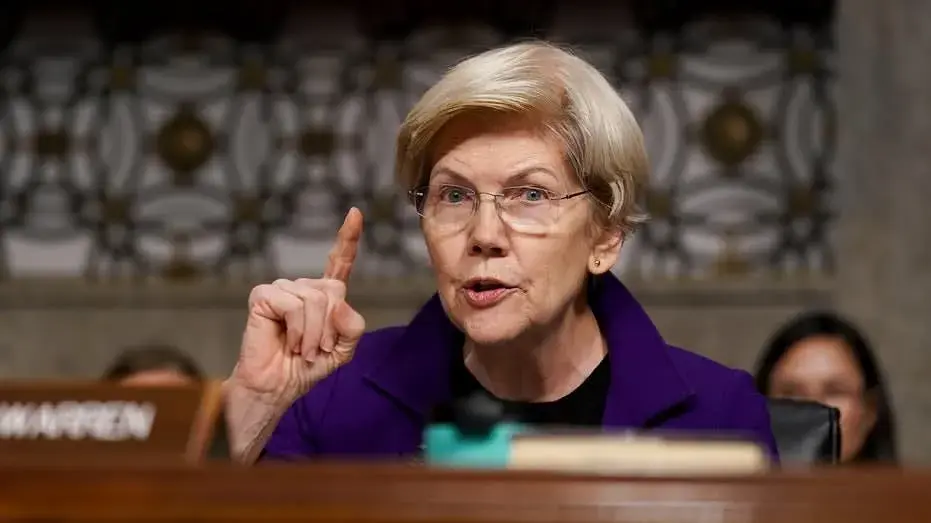 Warren gets defensive when pressed on Democrats accepting billionaire donations