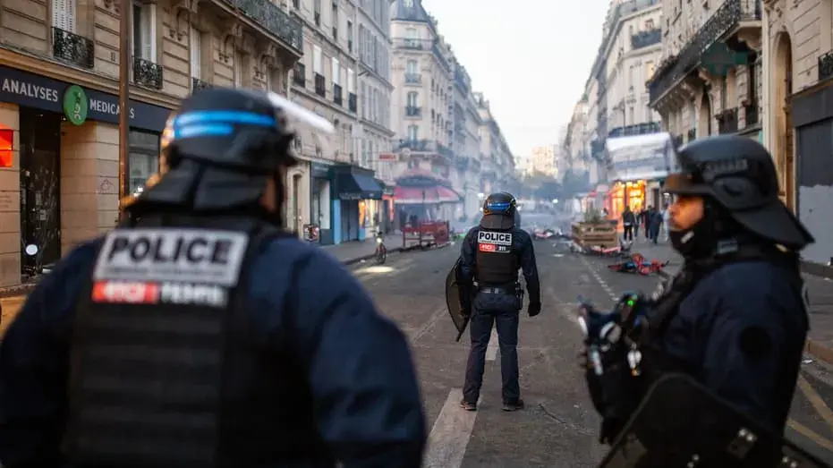 France's top soccer team obeys police order to move Sunday match; Saints, Steelers owners meet with Macron