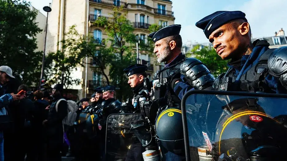 France on edge with 70,000 police deployed for unrest as authorities probe suspected terror attack near Paris