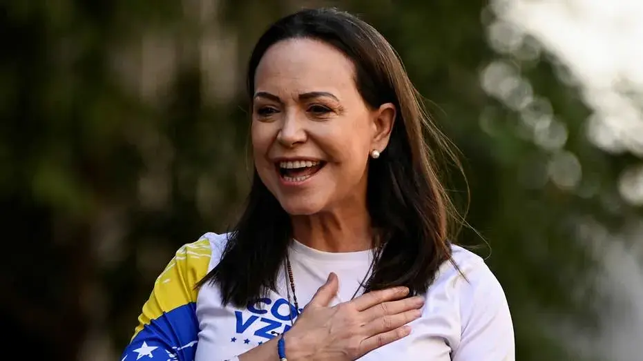 Venezuelan opposition leader María Corina Machado makes surprise return home after nearly a year abroad