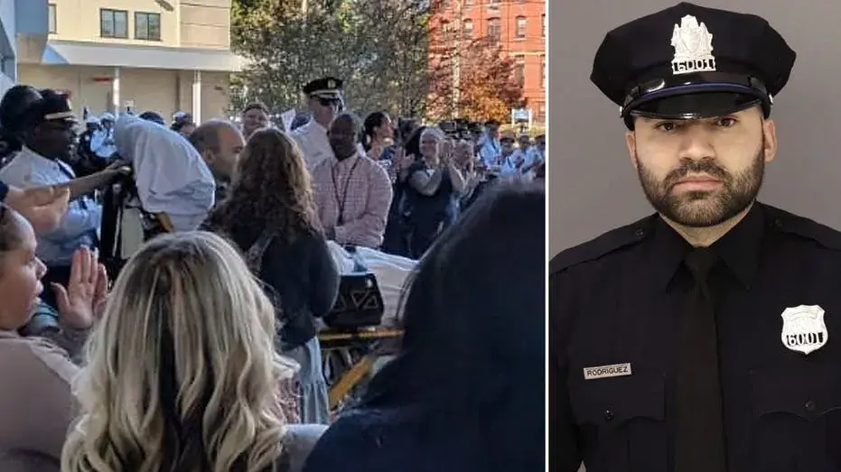 Shot 12 times in ambush that killed his partner, Philadelphia officer leaves hospital to cheers