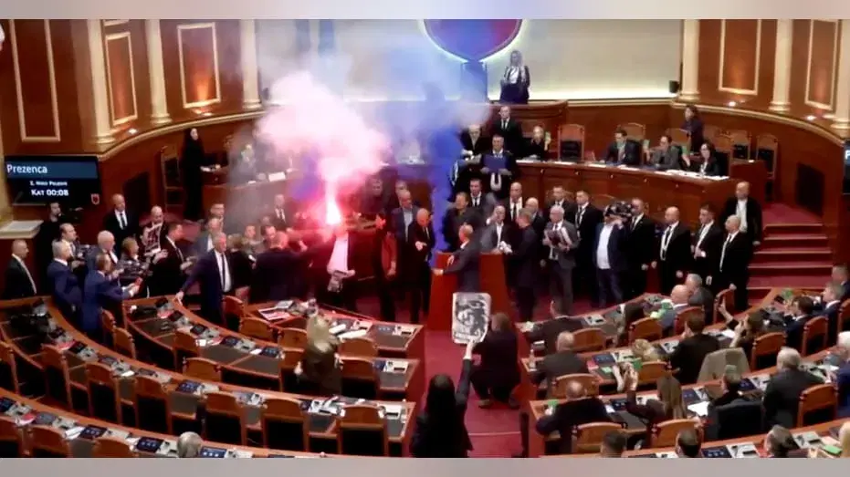 Albanian opposition lawmakers disrupt parliament with smoke flares and furious attacks on socialist PM